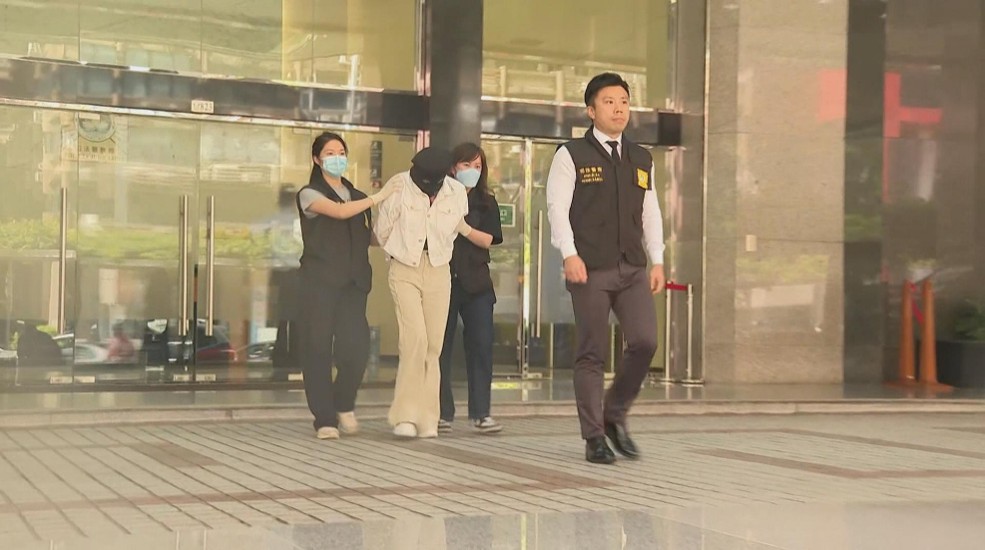 Macau Police escorting suspects