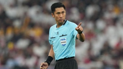 Chinese Referee Ma Ning pointing on the field